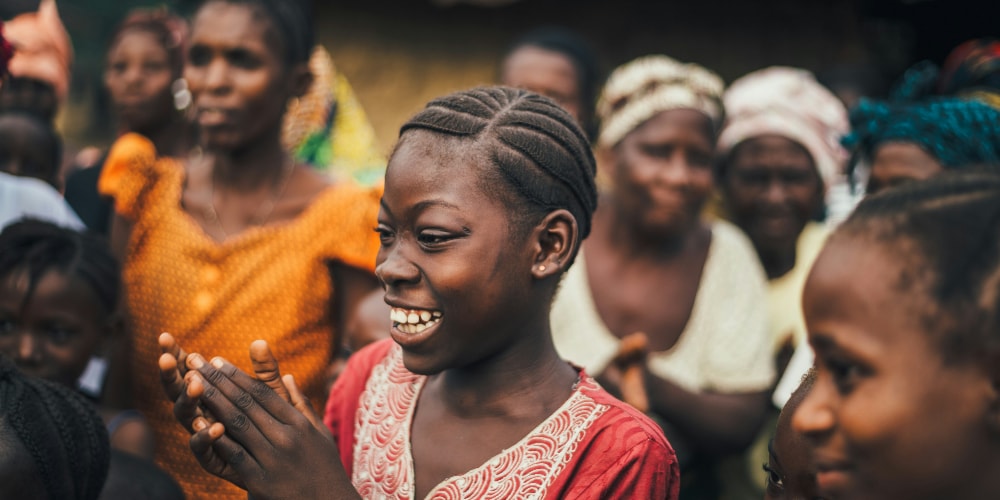 woman looking at someone while smiling